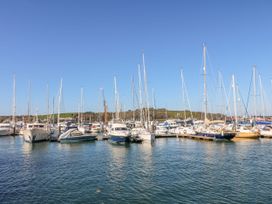 A marina with multiple boats docked at Trouts Reach Goldenbank near Budock Water
