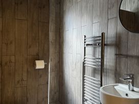 A bathroom with a wash basin and towel radiator at Mostyn View in West Kirby