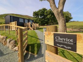 An exterior view of Cheviot property with pathway and fence in Oswestry