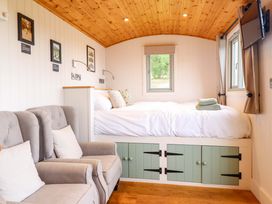 A bedroom with a bed and sofa at Cheviot in Oswestry
