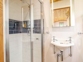 A bathroom featuring a shower and sink at Cheviot in Oswestry