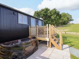 A spa and deck with steps at Cheviot in Oswestry