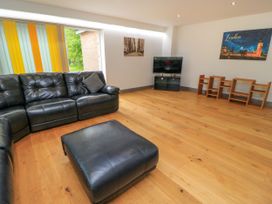A living room with a sofa and television at Silver Copse in Frilford Heath Near Abingdon