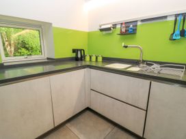 A kitchen with a sink and kettle at Silver Copse Frilford Heath Near Abingdon