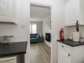 A kitchen looking into a living room at Cherry Tree in Kidlington