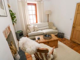 A living room with a sofa and coffee table at 18 Main Street 