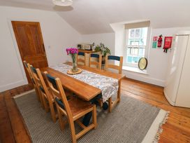 A dining room with a table and chairs at 18 Main Street 