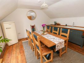 A dining room with a table and chairs at 18 Main Street 