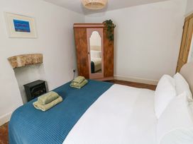 A bedroom with a bed and a wardrobe at 18 Main Street 