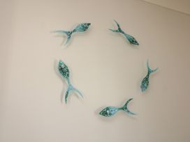 Decorative fish wall art at The Hideaway in 