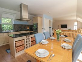 A kitchen with dining area at 1 Bryn Beudy in Stepaside