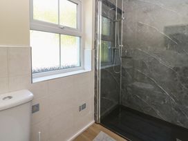 A bathroom with a shower and toilet at 1 Bryn Beudy in Stepaside