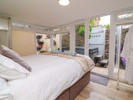 A bedroom with a bed and towels at Sea Sanctuary