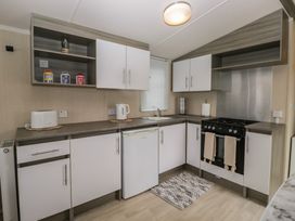 A kitchen with cabinets and appliances at Pinewood in Kidlington