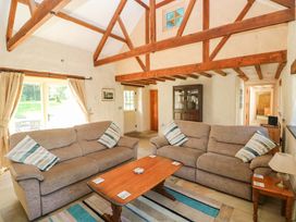 A living room with sofas and a coffee table at Carreg Las in Haverfordwest
