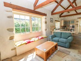 A living room with a sofa and coffee table at Carreg Las in Haverfordwest