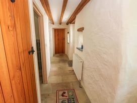 A hallway with doors and a radiator at Carreg Las in Haverfordwest