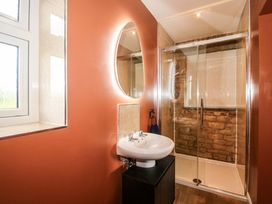 A bathroom with a sink and shower at Dingle in Cleobury Mortimer