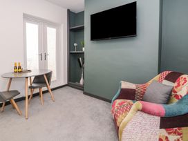 A living room with a table and chairs at Flat 1, Mona House in Conwy