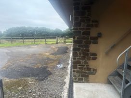 An exterior view showing stairs and gravel area at Hayes Lodge Coach House Ashreigney near Dolton