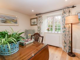 A study room with a desk and a window at Magdalen Cottage Hook Norton