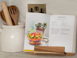 A cookbook open with a recipe in a kitchen at Apartment 1, 86 Dyer Street in Cirencester