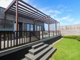 An outdoor area with a deck and stairs at Lodge 83, Gwel an Mor Portreath
