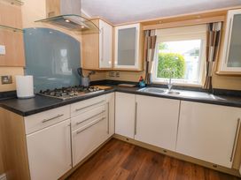 A kitchen with a sink and gas hob at Plot 12 in Carlisle