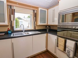 A kitchen with cabinets and appliances at Plot 12 Carlisle