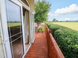 A balcony with a table and chairs at Plot 12 in Carlisle