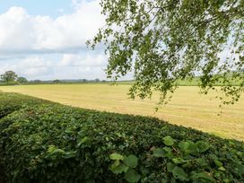 A field with grass and trees at Plot 12 in Carlisle