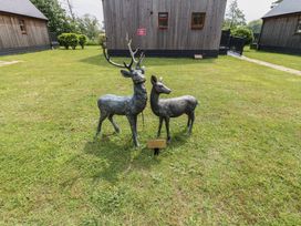 Two deer statues in a grassy area at Lodge 7 in Brigg