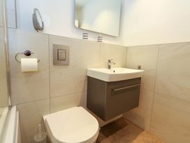 A bathroom with a sink and toilet at Apartment 11 in Poole