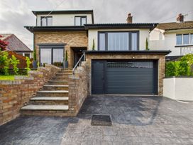A house with a garage and stairs at 59a Gwscwm Road