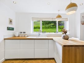 A kitchen with a sink and countertop at 59a Gwscwm Road 