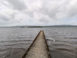 A pier extending over water at The Cottage in Ballinagleira