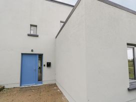 An exterior view of a blue door with a mailbox at The Cottage in Ballinagleira