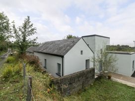 An outdoor view of a building and road at The Cottage in Ballinagleira