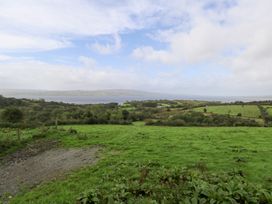 A scenic view of greenery and water at The Cottage in Ballinagleira