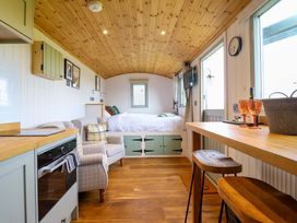 A studio with a kitchen and seating area at Charollais in Oswestry
