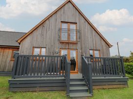 A house with a deck and stairs at Lodge 9 in Brigg