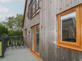 An outdoor area with a table and chairs at Lodge 13 in Brigg