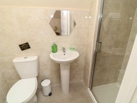 A bathroom with a sink and shower at Lodge 13 in Brigg