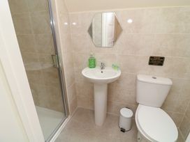 A bathroom with a sink shower and toilet at Lodge 13 in Brigg