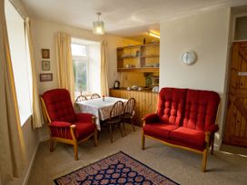 A dining room with a table and chairs at Chyancrowse in Gulval
