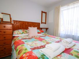 A bedroom with a bed and dresser at Chyancrowse in Gulval