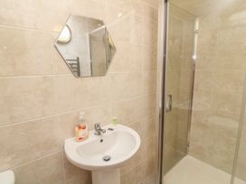 A bathroom with a sink and shower at Lodge 14 in Brigg