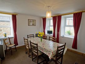 A dining room with a table and chairs at Chyandaunce in Gulval