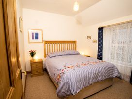 A bedroom with a bed and bedside table at Chyandaunce in Gulval