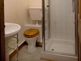A bathroom with a sink, toilet, and shower at Chyandaunce in Gulval